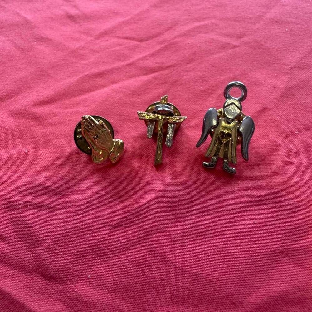 Lot of 3 religious pins with praying hands, cross, and angel designs